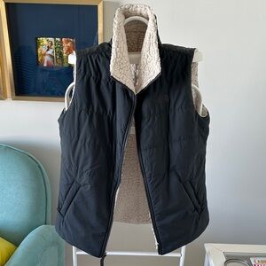 Women’s size Large reversible North Face vest